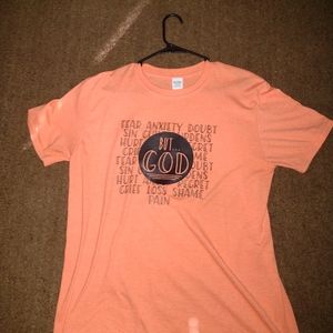 "But....God" shirt in a petty pink coral color and  a size large